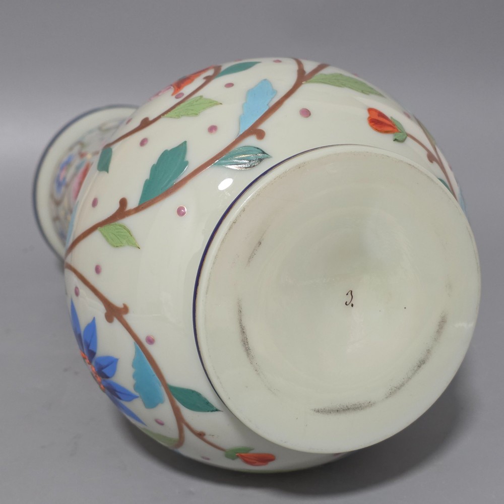 An antique cream opaque glass vase featuring hand-painted floral arabesque enamel patterns in bright colours with gilded accents and cobalt blue bands. View XIII