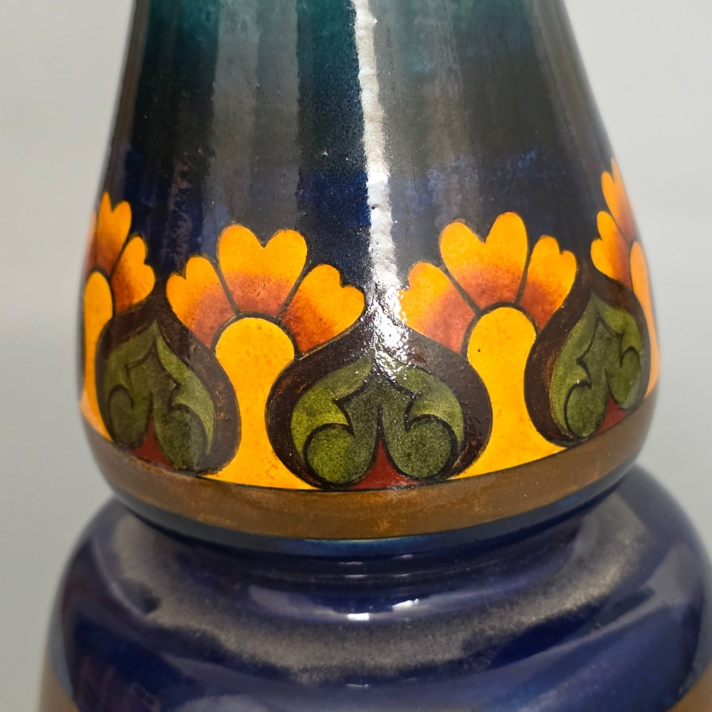 A late Victorian double-gourd earthenware vase with hand-painted fruit roundels, stylized floral bands, and a gradient turquoise to blue neck. View IX