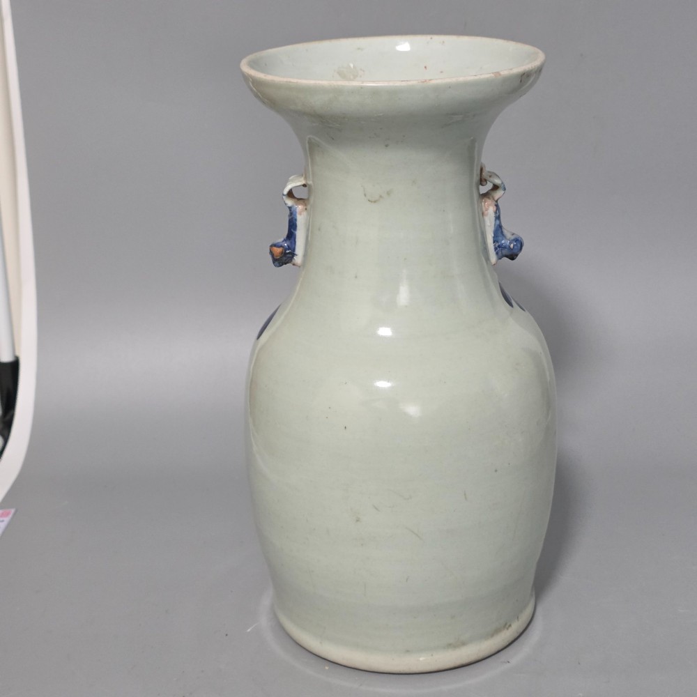 A 19th-century Chinese baluster porcelain vase featuring a pale celadon glaze decorated with hand-painted cobalt blue floral motifs and moulded neck handles. View III