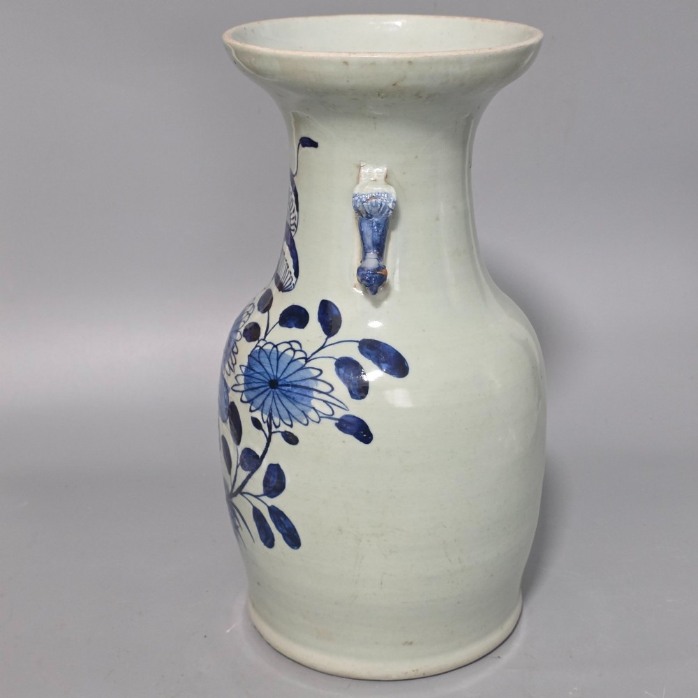 A 19th-century Chinese baluster porcelain vase featuring a pale celadon glaze decorated with hand-painted cobalt blue floral motifs and moulded neck handles. View IV