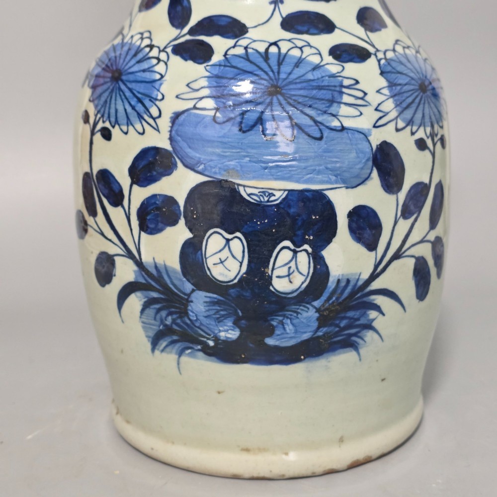 A 19th-century Chinese baluster porcelain vase featuring a pale celadon glaze decorated with hand-painted cobalt blue floral motifs and moulded neck handles. View VII