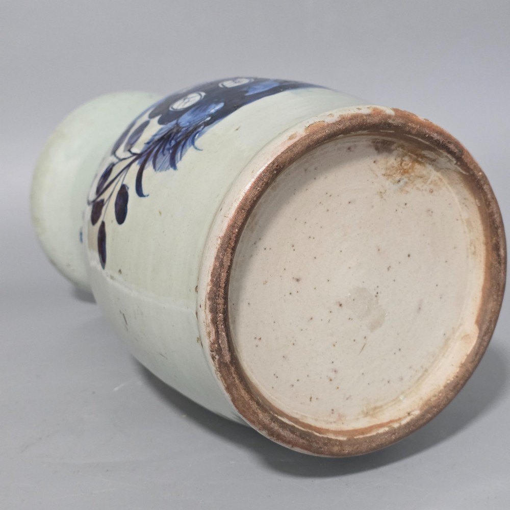 A 19th-century Chinese baluster porcelain vase featuring a pale celadon glaze decorated with hand-painted cobalt blue floral motifs and moulded neck handles. View VIII