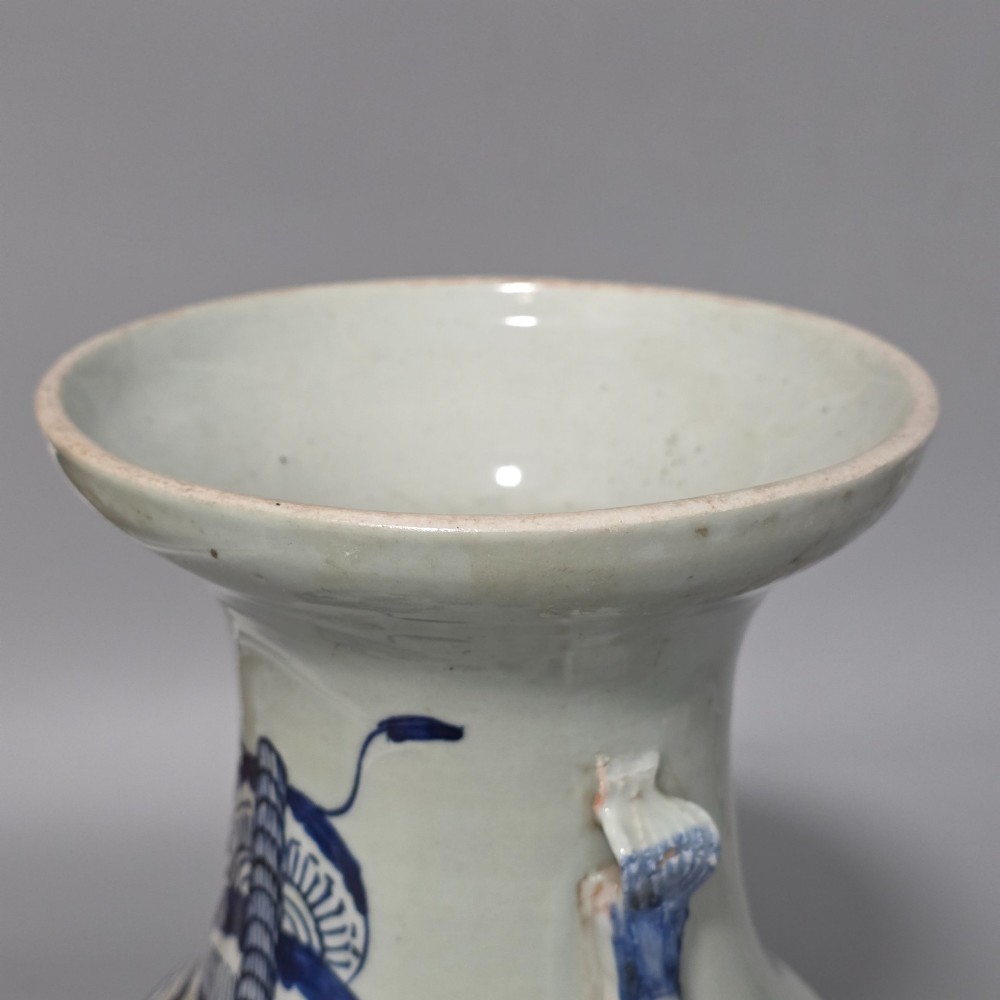 A 19th-century Chinese baluster porcelain vase featuring a pale celadon glaze decorated with hand-painted cobalt blue floral motifs and moulded neck handles. View XI
