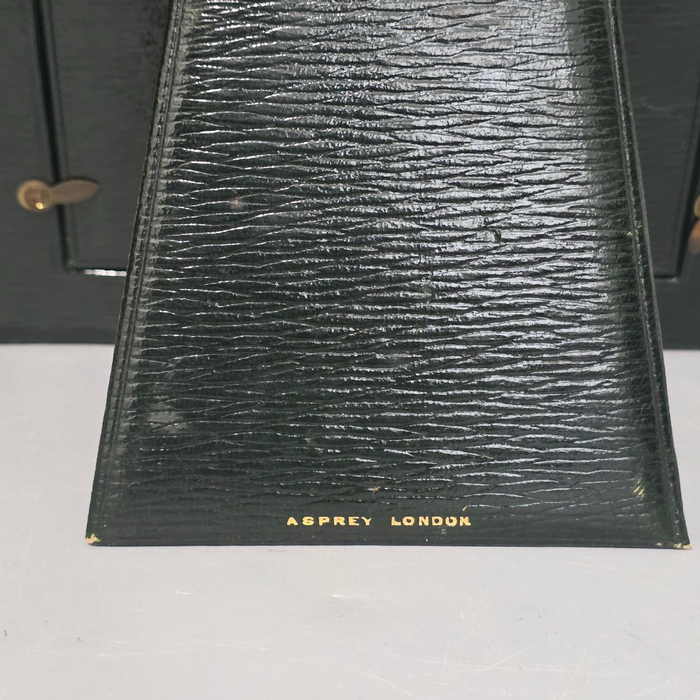 A brown textured leather photo frame featuring an arched top and a central rectangular aperture backed with moire silk. View VIII