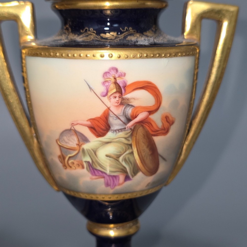 A pair of cobalt blue and gold Vienna porcelain Empire amphora vases featuring hand-painted classical figures and square plinth bases. View VII