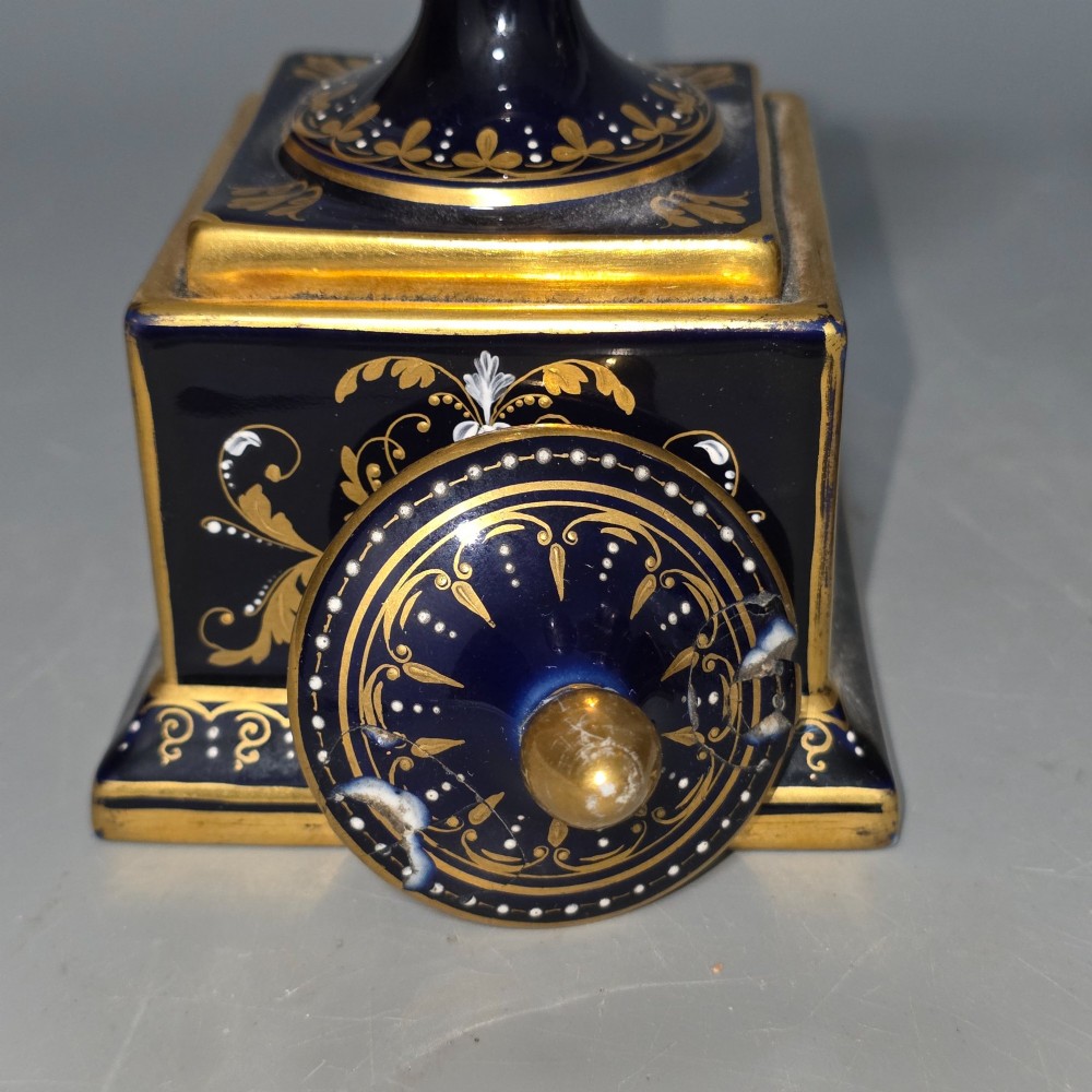 A pair of cobalt blue and gold Vienna porcelain Empire amphora vases featuring hand-painted classical figures and square plinth bases. View XIV