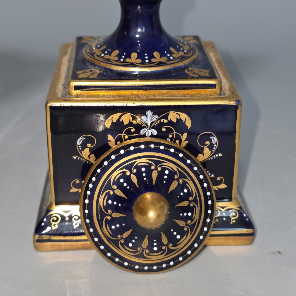 A pair of cobalt blue and gold Vienna porcelain Empire amphora vases featuring hand-painted classical figures and square plinth bases. View XV