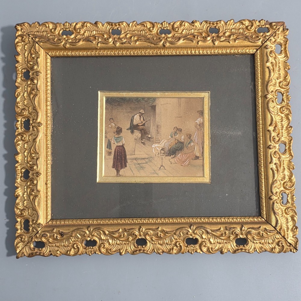 A pair of rectangular antique gilt-framed pictures featuring figurative genre scenes set against dark matting. View VI