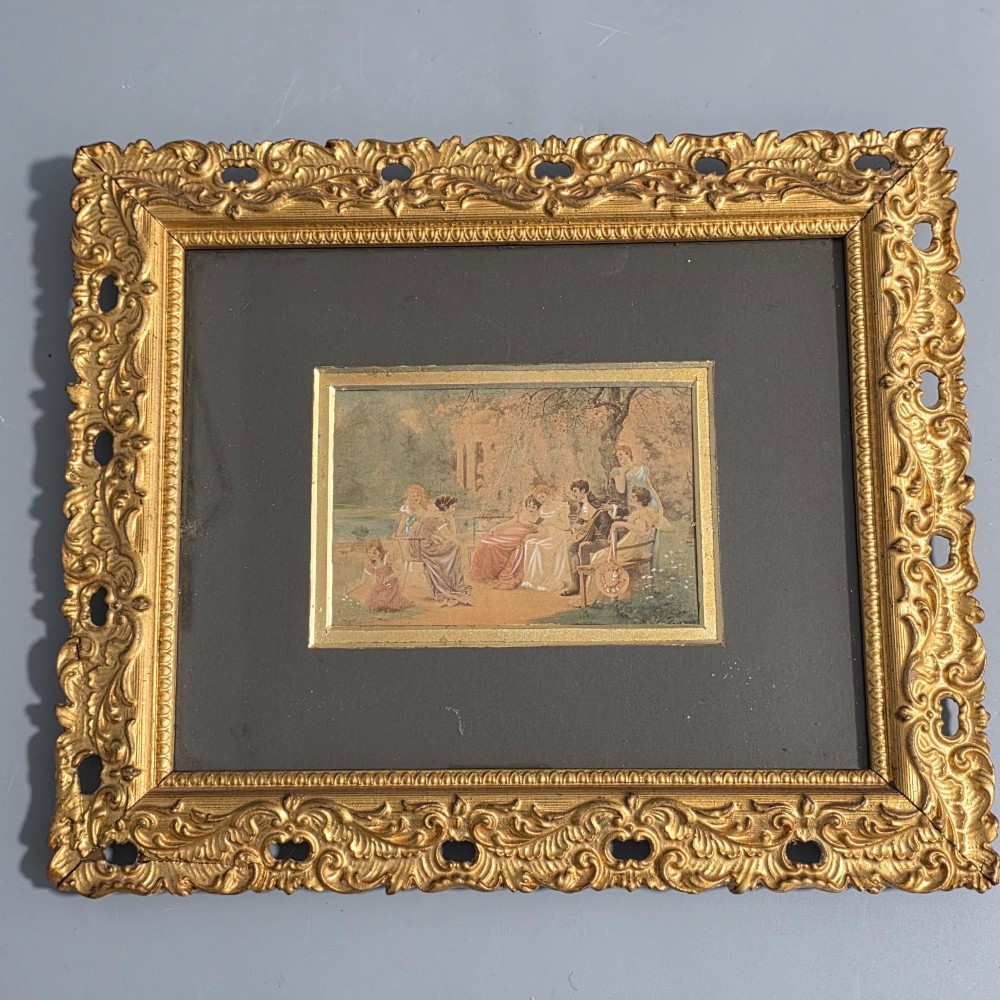 A pair of rectangular antique gilt-framed pictures featuring figurative genre scenes set against dark matting. View VII
