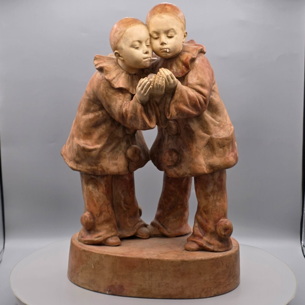 A terracotta sculpture featuring two Pierrot figures in ruffled collars standing together on an oval plinth, designed as a lamp base. View XIII