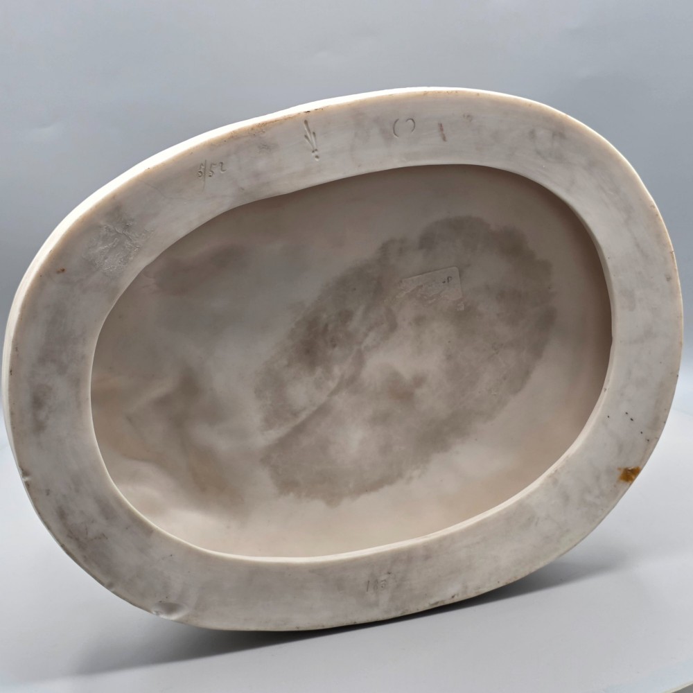 A Victorian off-white parian porcelain figural group depicting three women in classical draped robes on an oval base. View XIII