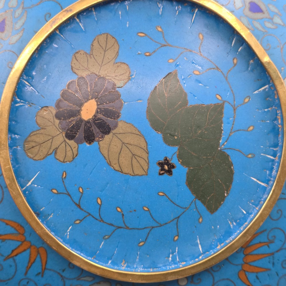A circular Japanese Meiji period cloisonne enamel charger depicting birds perched on branches with flowers against a bright blue background. View XI
