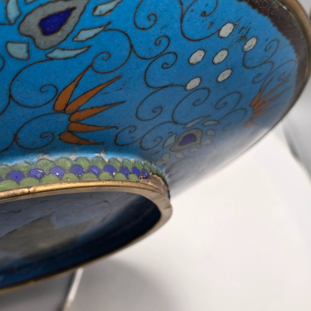 A circular Japanese Meiji period cloisonne enamel charger depicting birds perched on branches with flowers against a bright blue background. View XIII