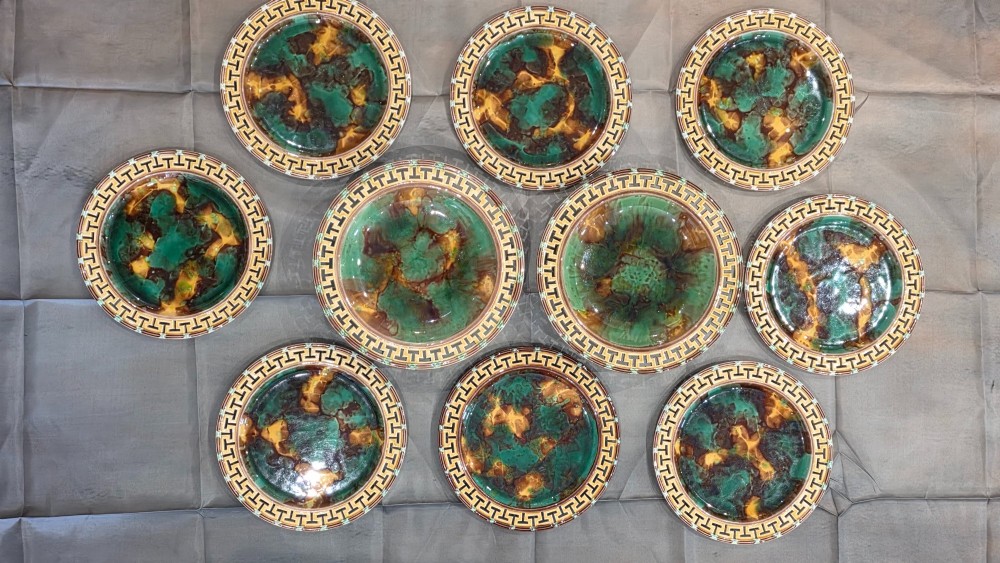 A ten-piece nineteenth-century Wedgwood majolica dessert service featuring green and brown mottled glazes surrounded by classical Greek key pattern borders. View II