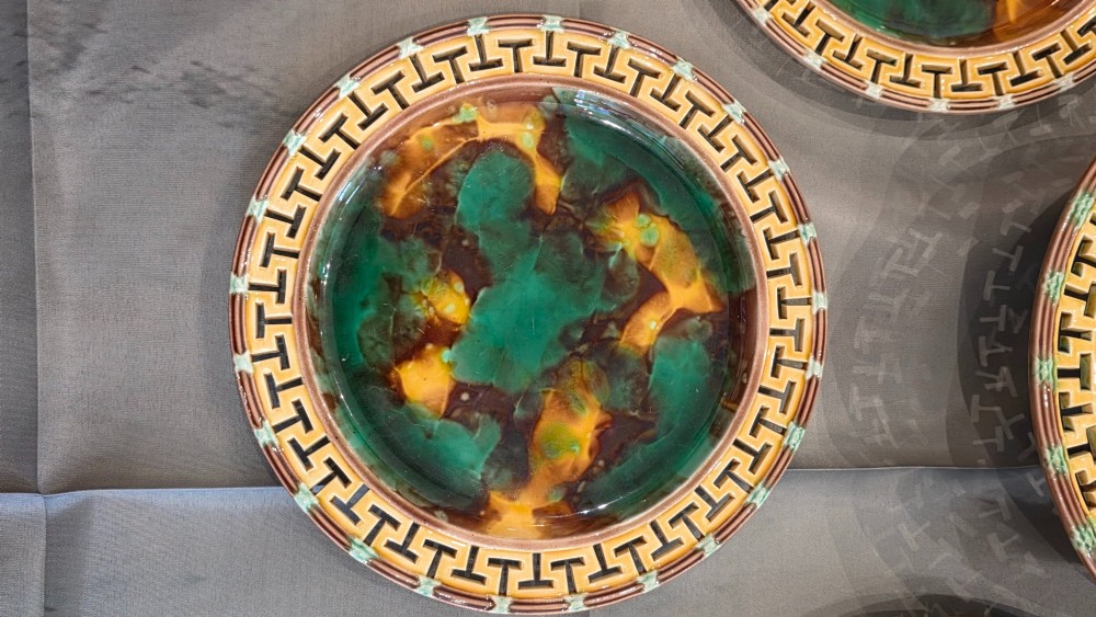 A ten-piece nineteenth-century Wedgwood majolica dessert service featuring green and brown mottled glazes surrounded by classical Greek key pattern borders. View III