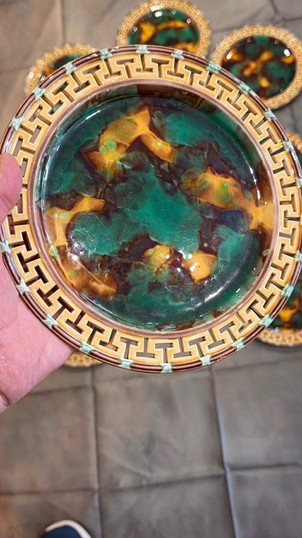 A ten-piece nineteenth-century Wedgwood majolica dessert service featuring green and brown mottled glazes surrounded by classical Greek key pattern borders. View IV