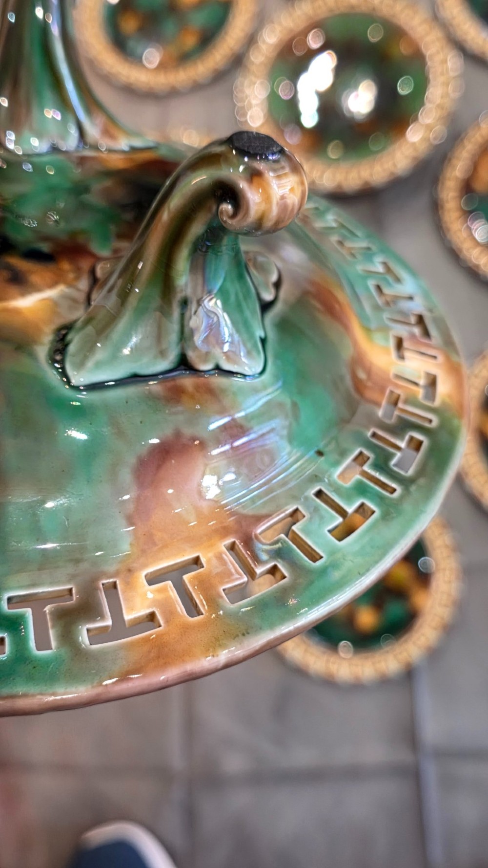 A ten-piece nineteenth-century Wedgwood majolica dessert service featuring green and brown mottled glazes surrounded by classical Greek key pattern borders. View V