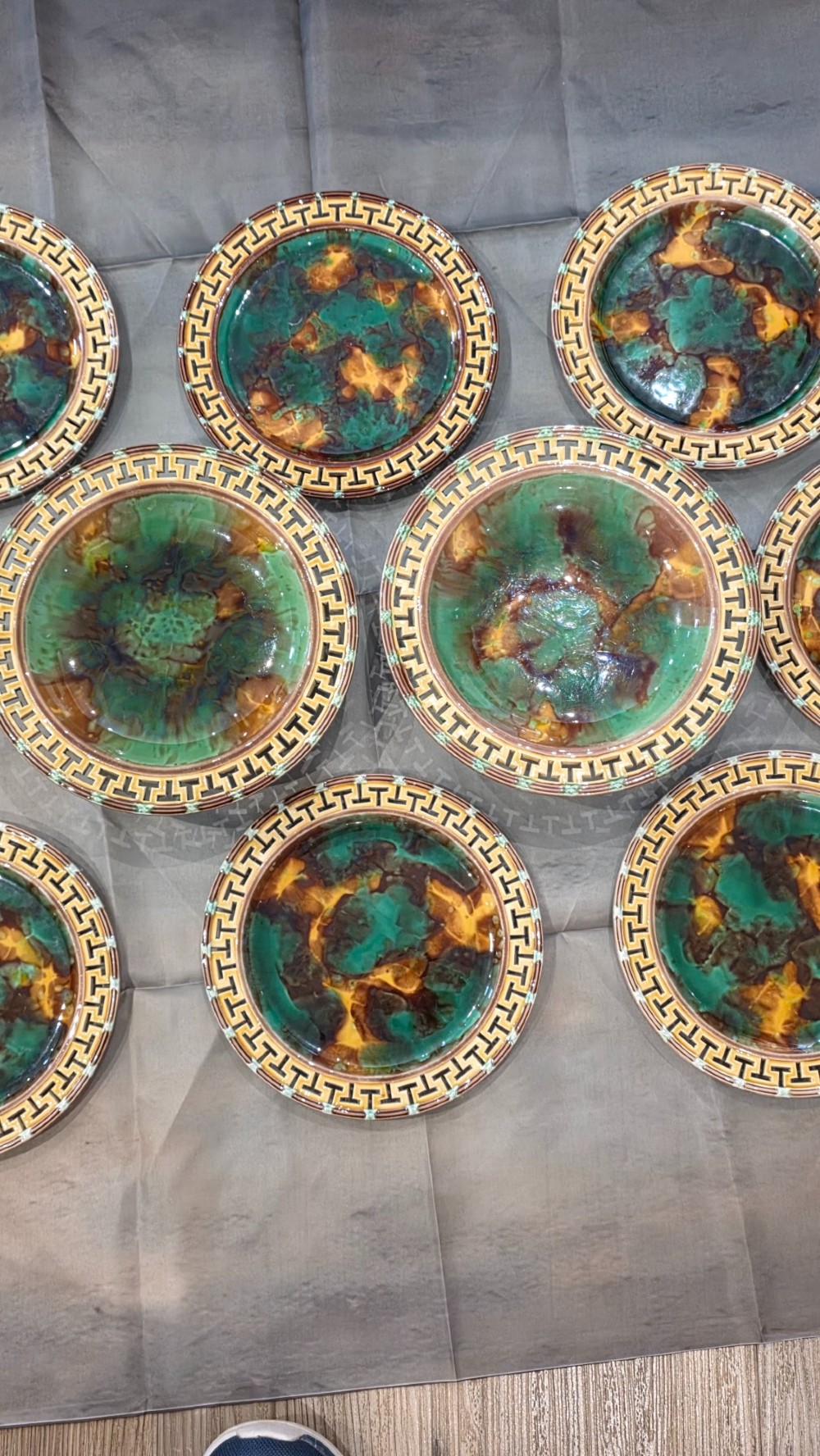 A ten-piece nineteenth-century Wedgwood majolica dessert service featuring green and brown mottled glazes surrounded by classical Greek key pattern borders. View VI