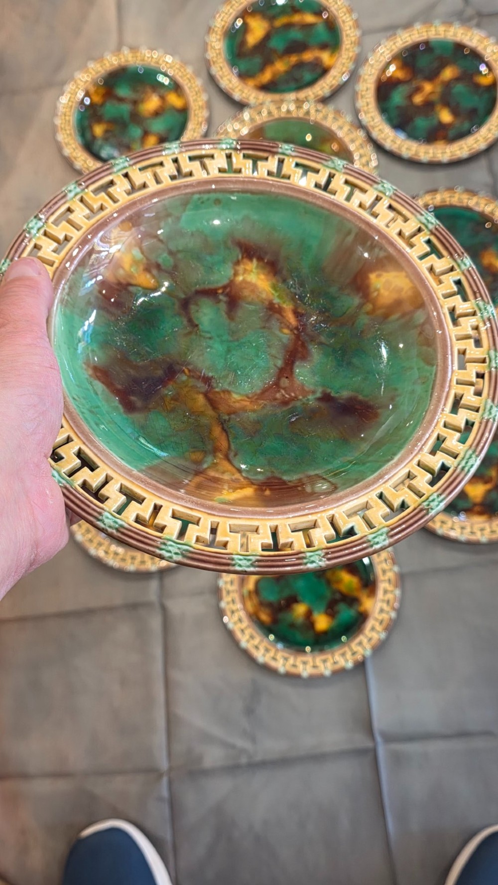 A ten-piece nineteenth-century Wedgwood majolica dessert service featuring green and brown mottled glazes surrounded by classical Greek key pattern borders. View IX