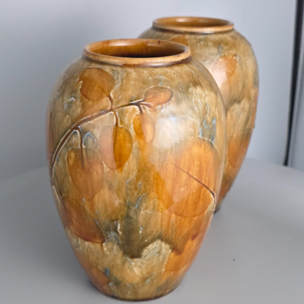 A pair of Edwardian baluster-shaped stoneware vases with warm ochre glaze and impressed leaf motifs. View XIII