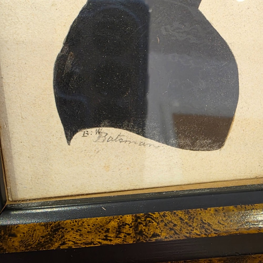 A small framed early 19th-century silhouette portrait depicting the right profile of a gentleman in a high-collared coat, presented in a decorated wood frame. View IV