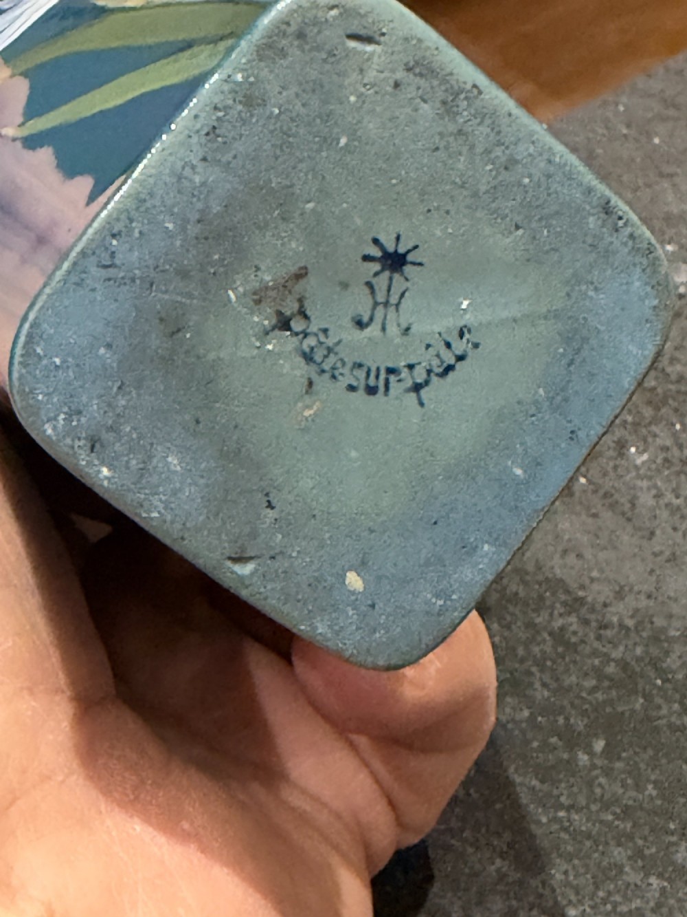 A tapered teal blue porcelain vase featuring twin loop handles and white pate-sur-pate floral relief decoration. View VIII