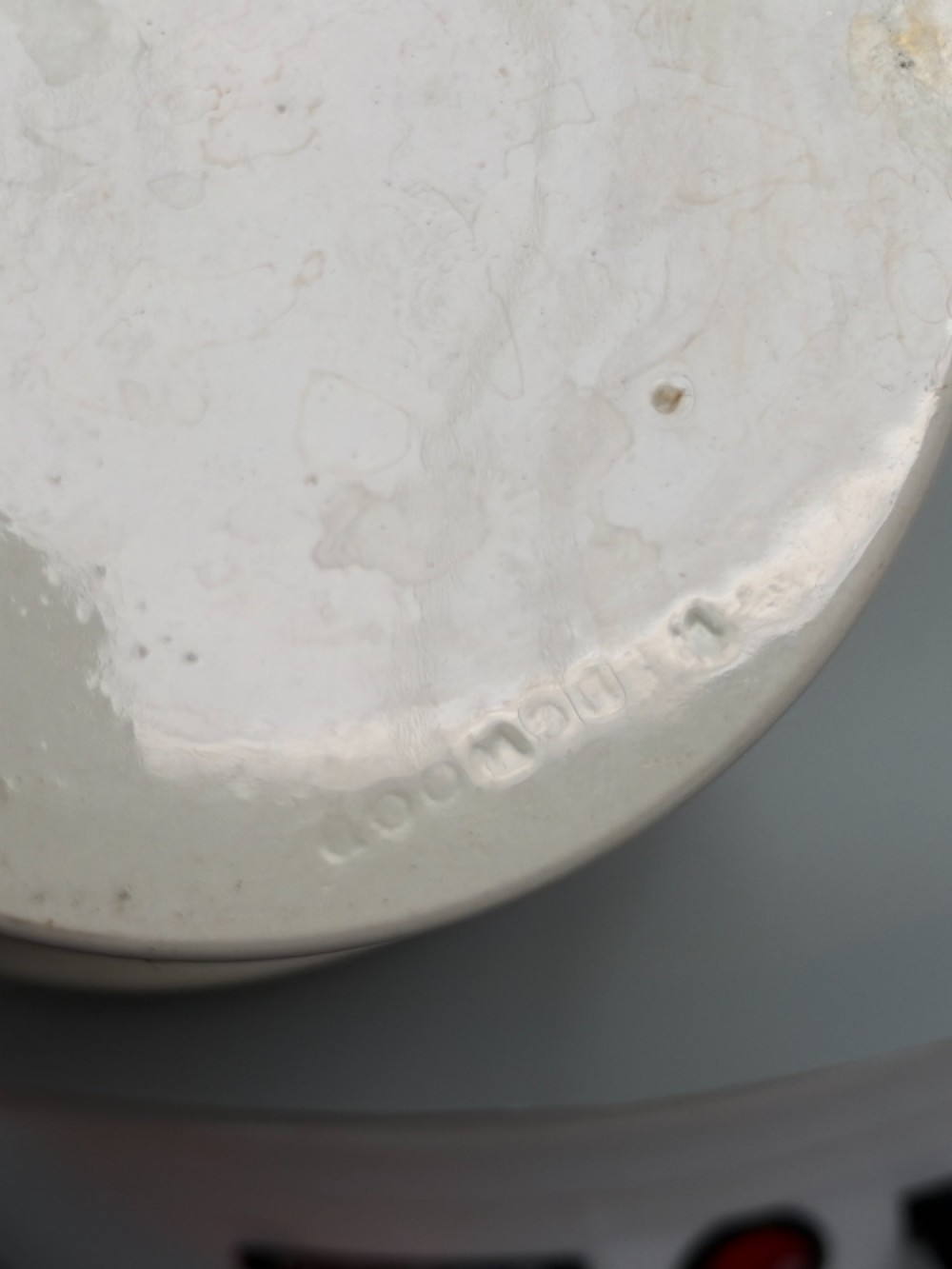 A set of three graduated off-white ceramic cylindrical vessels featuring dark iron bands around the upper rims and extended iron handles. View XI