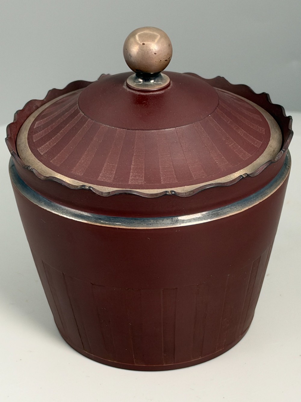 An 18th-century terracotta-coloured red stoneware sugar basin and lid with engine-turned vertical fluting and a metal ball finial. View II