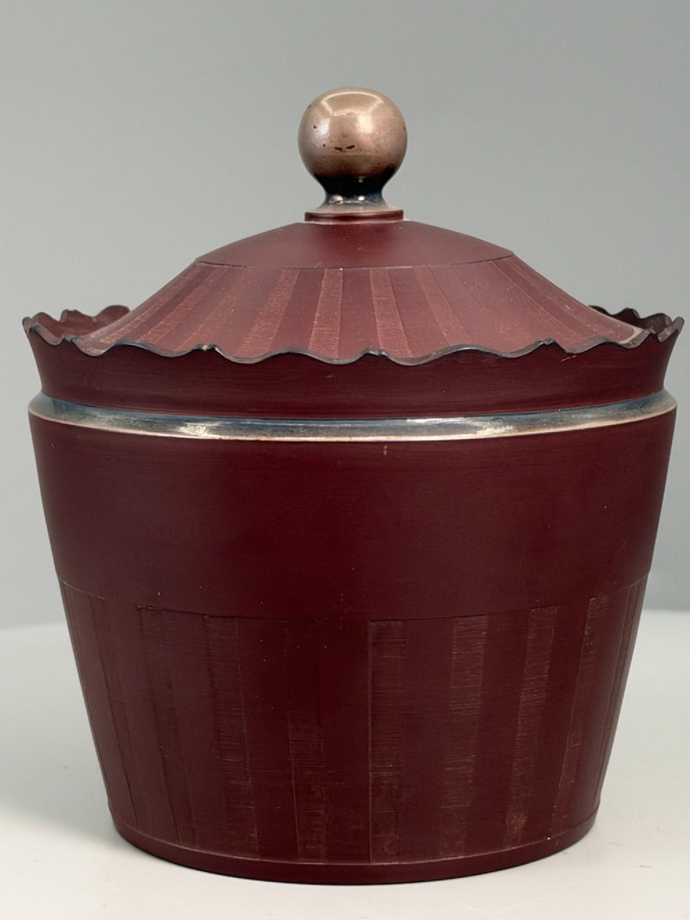 An 18th-century terracotta-coloured red stoneware sugar basin and lid with engine-turned vertical fluting and a metal ball finial. View III