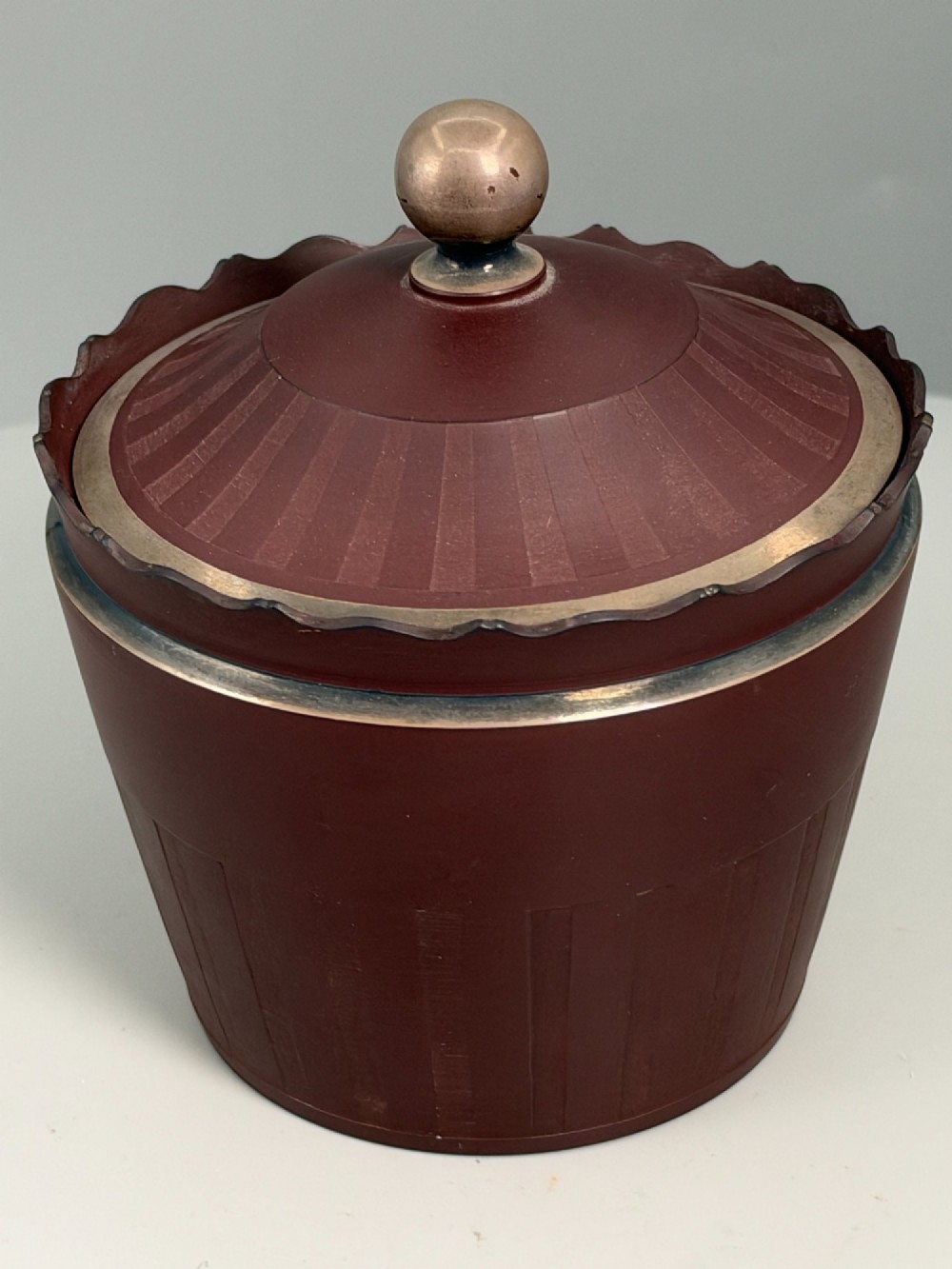 An 18th-century terracotta-coloured red stoneware sugar basin and lid with engine-turned vertical fluting and a metal ball finial. View IV