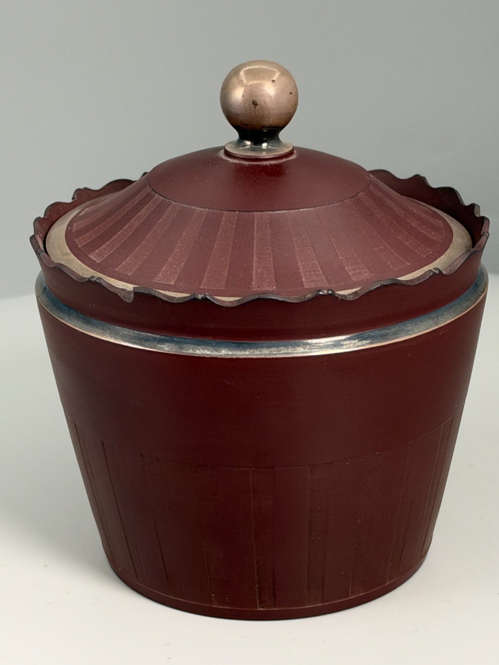 An 18th-century terracotta-coloured red stoneware sugar basin and lid with engine-turned vertical fluting and a metal ball finial. View V