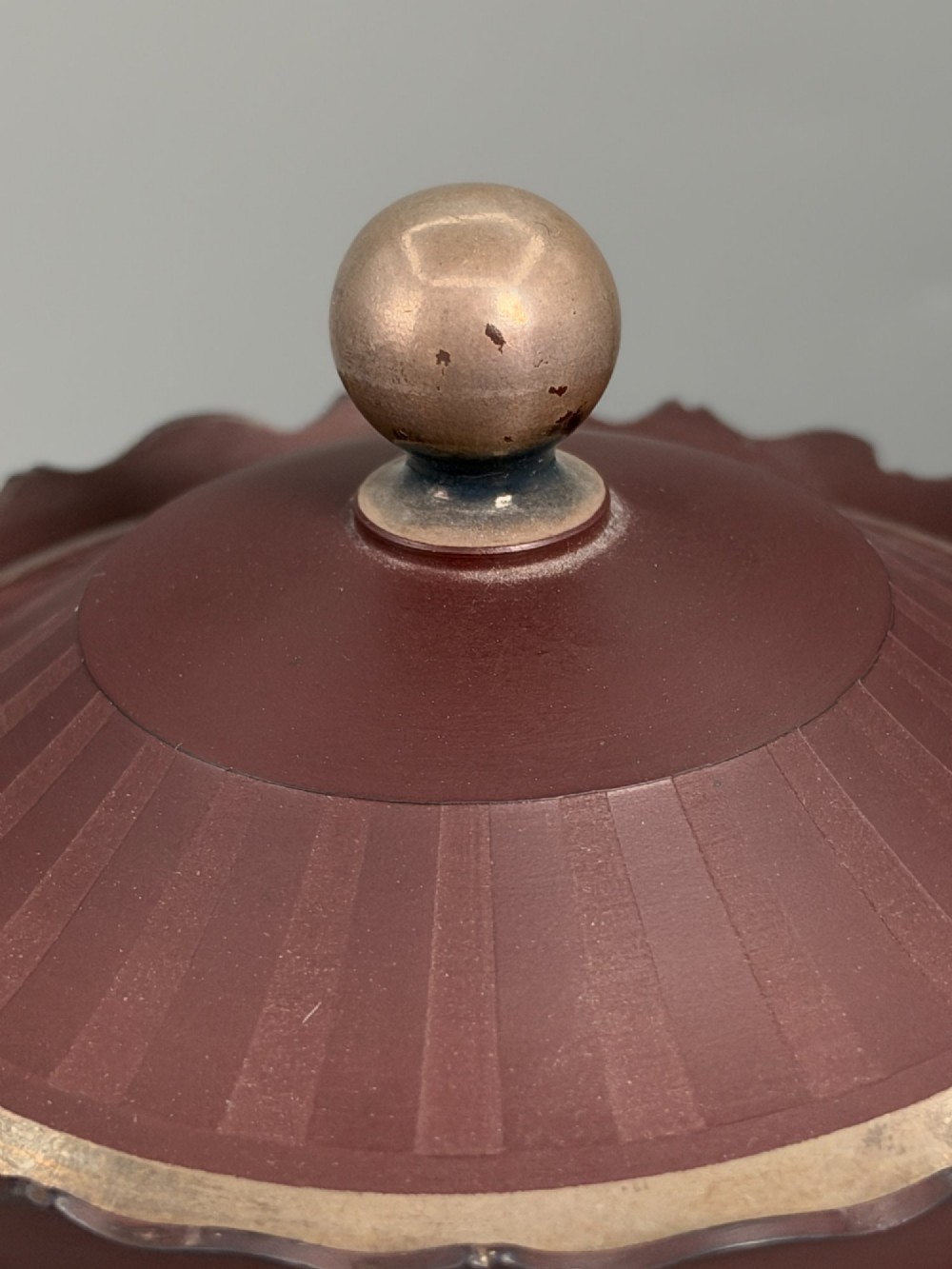 An 18th-century terracotta-coloured red stoneware sugar basin and lid with engine-turned vertical fluting and a metal ball finial. View VI