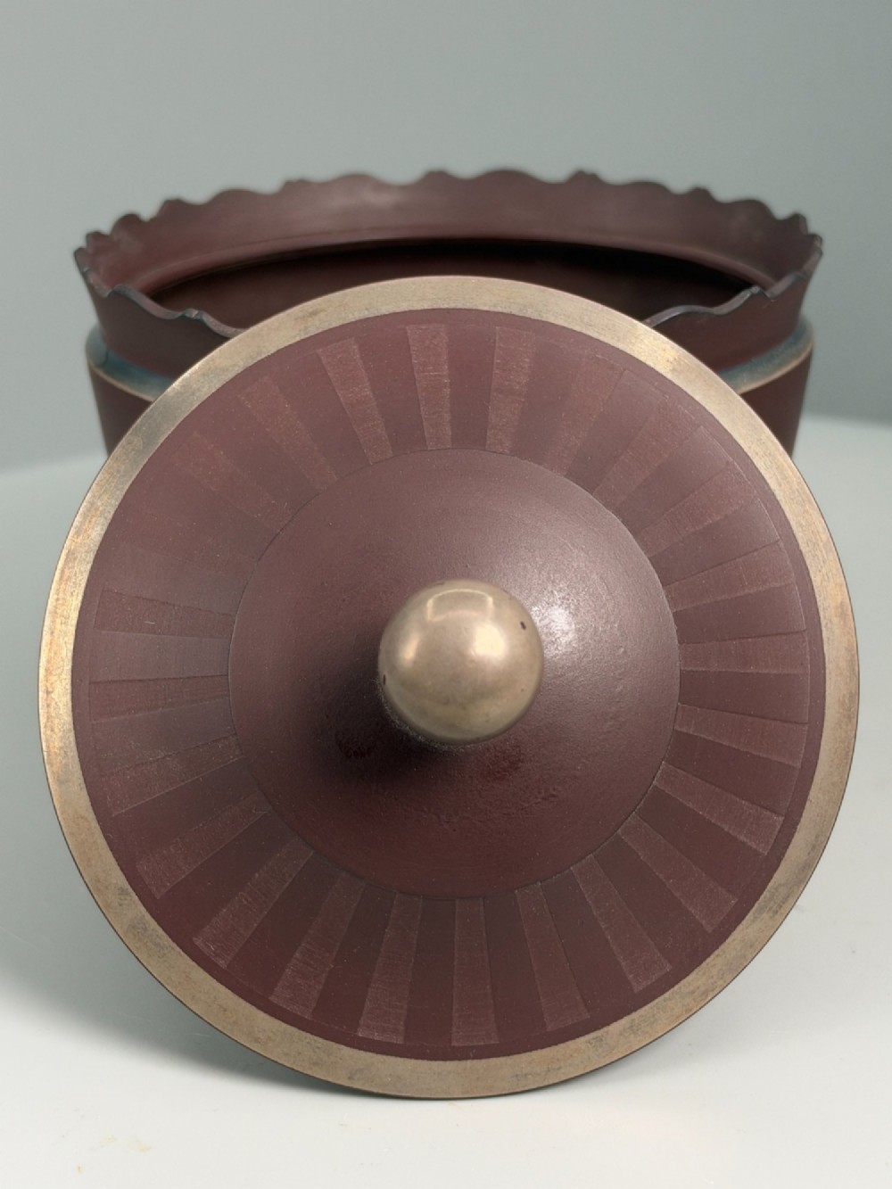 An 18th-century terracotta-coloured red stoneware sugar basin and lid with engine-turned vertical fluting and a metal ball finial. View VIII