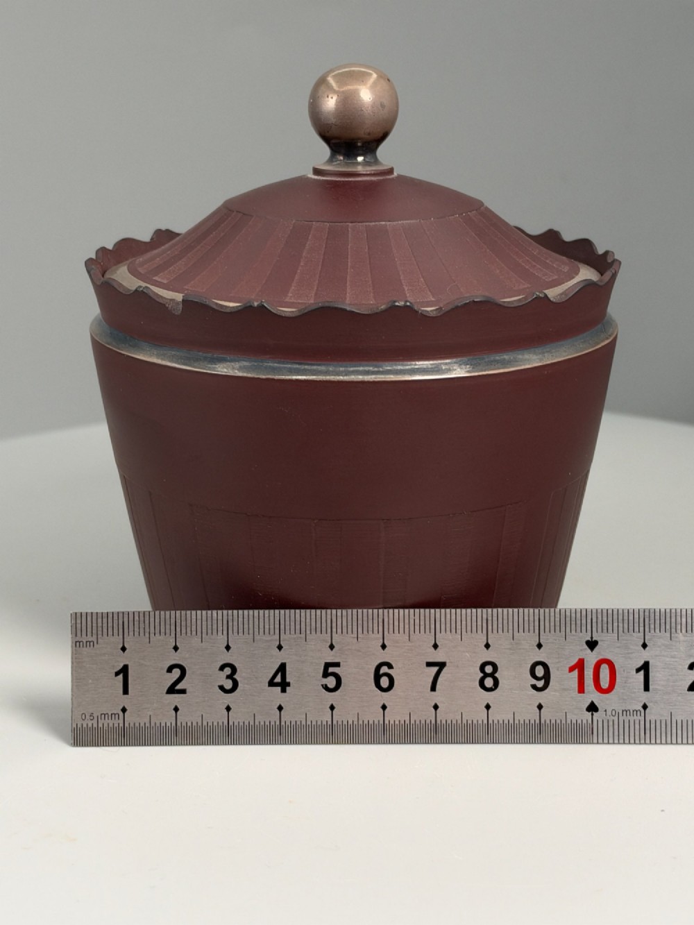 An 18th-century terracotta-coloured red stoneware sugar basin and lid with engine-turned vertical fluting and a metal ball finial. View XIII