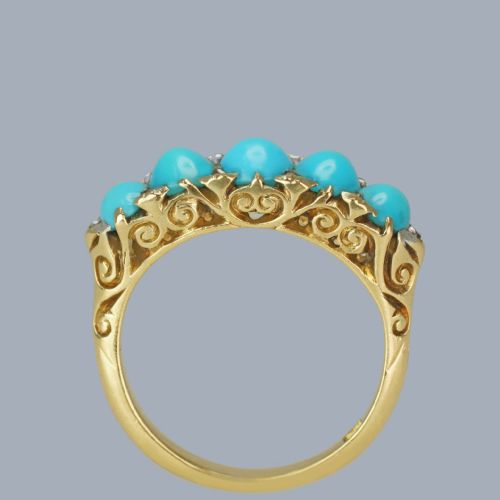 fig 1. An 18ct yellow gold Victorian ring set with five graduated cabochon turquoise stones punctuated by small diamond points.