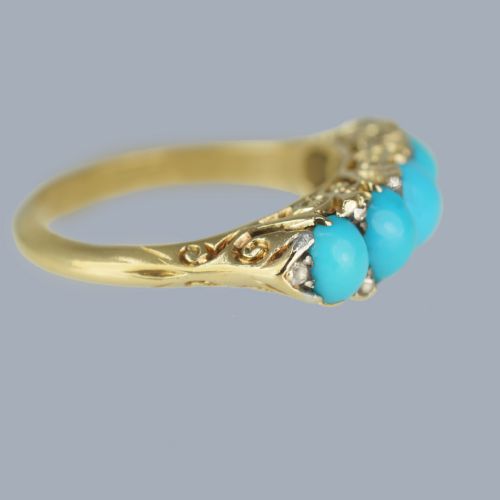 fig 2. An 18ct yellow gold Victorian ring set with five graduated cabochon turquoise stones punctuated by small diamond points.