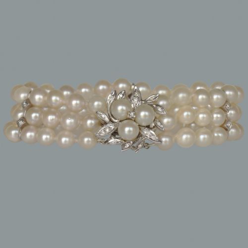 VINTAGE TRIPLE STRAND CULTURED PEARL BRACELET WITH DIAMOND FLORAL CLASP IN 14CT GOLD CIRCA 1950S