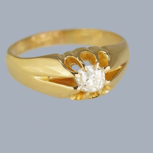 fig 2. An 18ct yellow gold band featuring a central Old European cut diamond set within a fluted starburst mount.