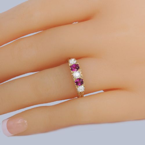 fig 1. An 18ct yellow gold late Victorian five-stone ring featuring alternating oval rubies and old mine cut diamonds set in a claw gallery.