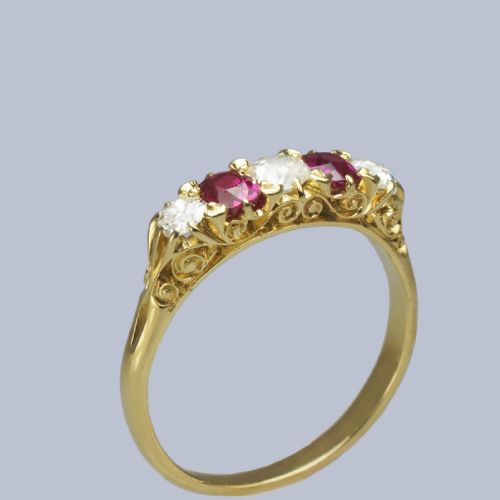 fig 2. An 18ct yellow gold late Victorian five-stone ring featuring alternating oval rubies and old mine cut diamonds set in a claw gallery.