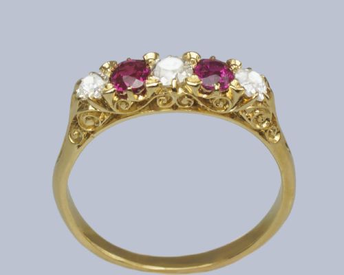 fig 3. An 18ct yellow gold late Victorian five-stone ring featuring alternating oval rubies and old mine cut diamonds set in a claw gallery.