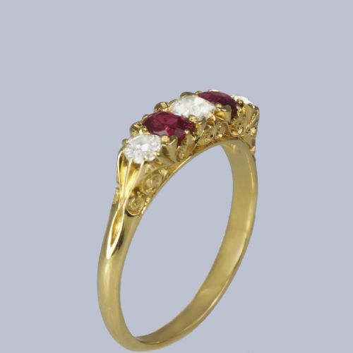 fig 4. An 18ct yellow gold late Victorian five-stone ring featuring alternating oval rubies and old mine cut diamonds set in a claw gallery.