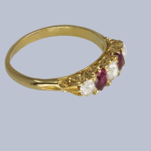 fig 5. An 18ct yellow gold late Victorian five-stone ring featuring alternating oval rubies and old mine cut diamonds set in a claw gallery.