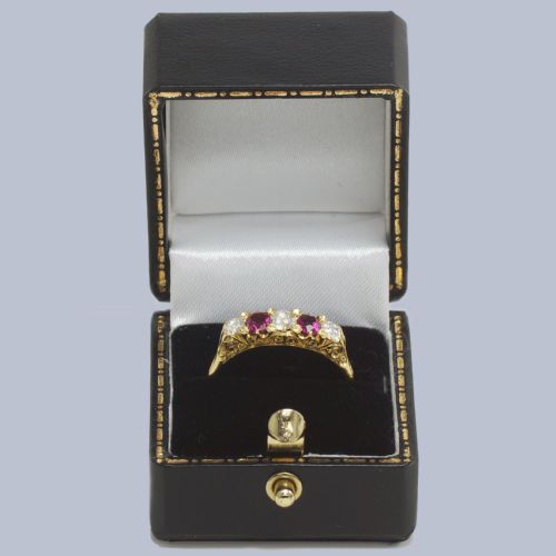 fig 9. An 18ct yellow gold late Victorian five-stone ring featuring alternating oval rubies and old mine cut diamonds set in a claw gallery.