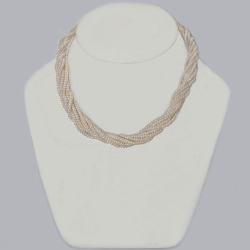fig 1. An eight-strand freshwater seed pearl necklace with a fluted yellow gold barrel clasp.