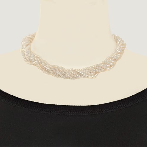 fig 7. An eight-strand freshwater seed pearl necklace with a fluted yellow gold barrel clasp.