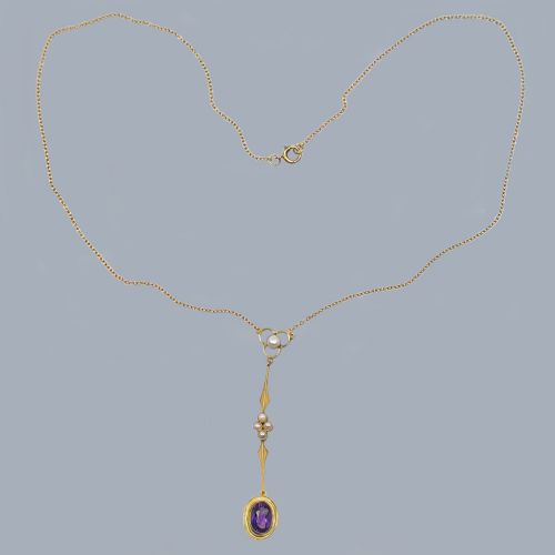 fig 4. An Edwardian 9ct gold drop necklace featuring a fine chain suspending an elongated linear pendant set with seed pearls and an oval-cut amethyst.