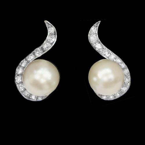 fig 2. A pair of 18ct white gold stud earrings featuring round cream pearls accented with sweeping bands of grain-set diamonds.