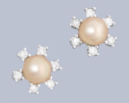 fig 4. A pair of 18ct white gold stud earrings featuring a central cream pearl surrounded by six claw-set diamonds in a floral cluster arrangement.