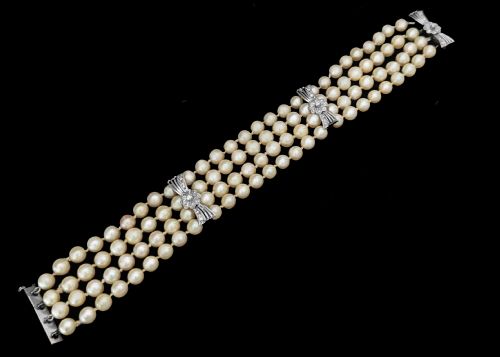 fig 3. A vintage four-strand cultured pearl bracelet connected by three white gold bow-shaped spacers set with small diamonds.